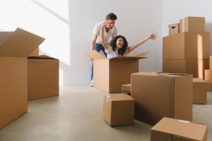 Couple unpacking moving boxes after moving to Galloway Township, NJ